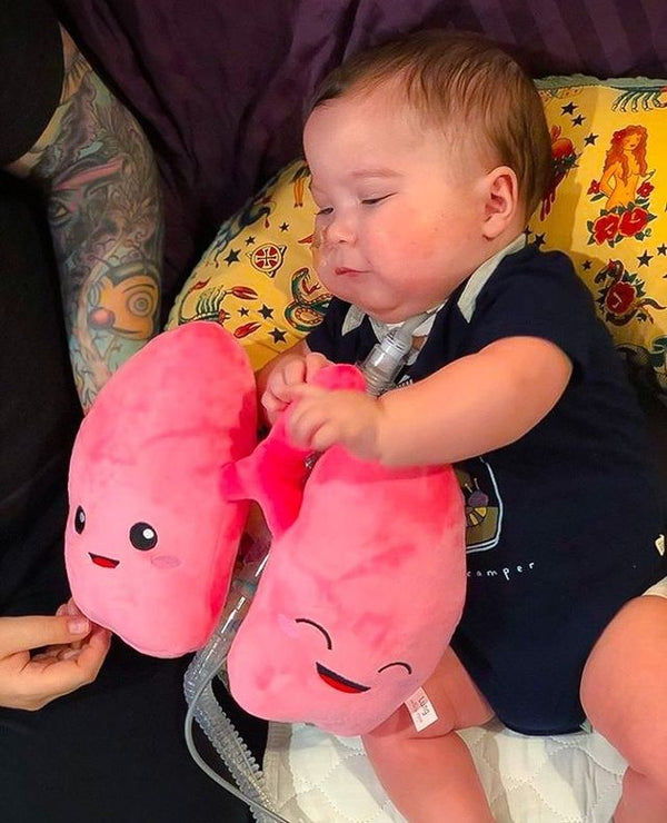 Baby Holding a Nerdbugs Lung Organ Plushie