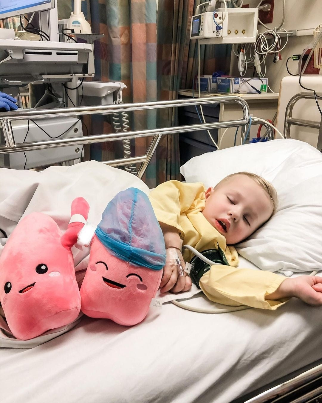 Toddler sleeping with Nerdbugs Lung Plushie Organ on his side