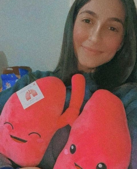 Lady holding a Nerdbugs Lung Plushie Organ