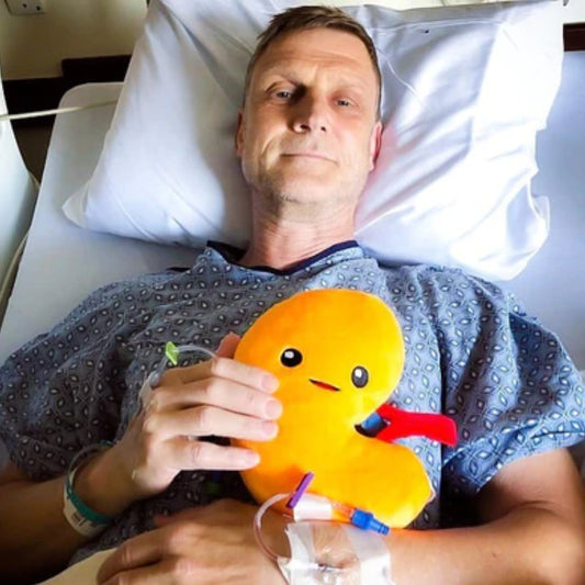 Man holding a Nerdbugs Kidney Organ Plushie