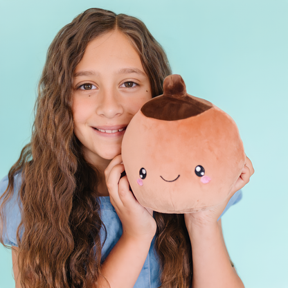 girl holding a tan breast toy plushie